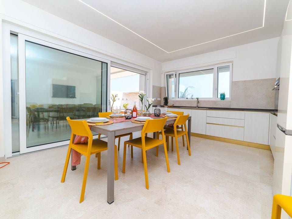 Furniture, Interior Design, Flooring, Wood, Floor, Ceiling, Chair, Lighting, Table, Kitchen & Dining Room Table