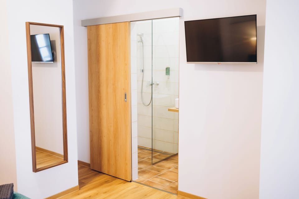 Deluxe Double or Twin Room, City View | Bathroom | Shower, hair dryer, towels, soap