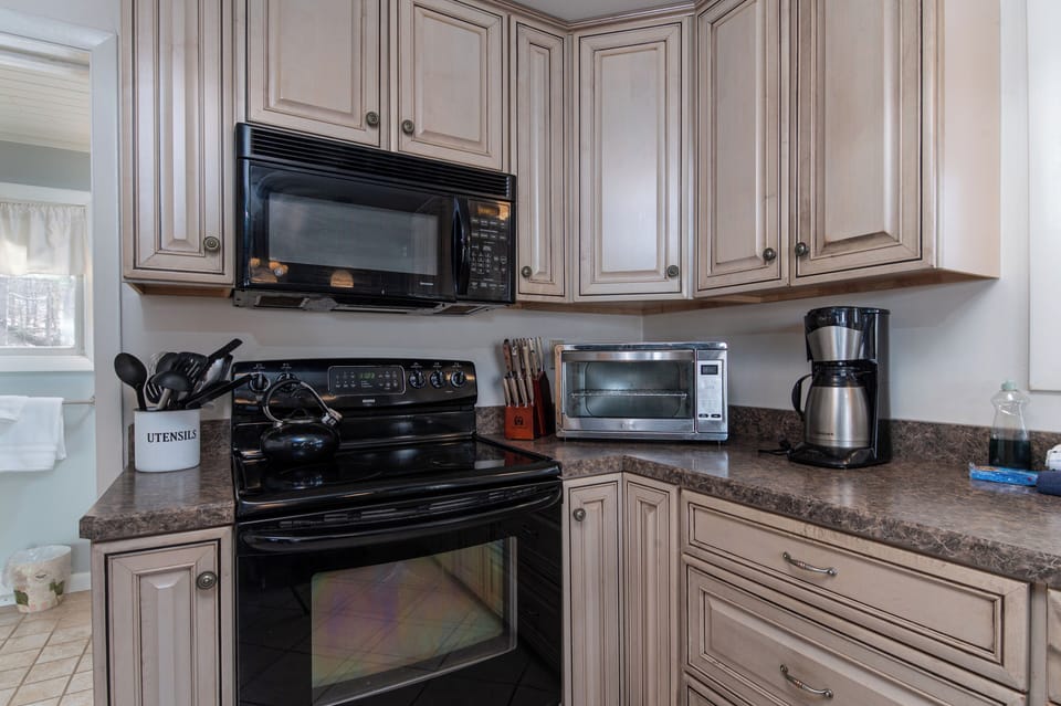- Kitchen with modern stove microwave and toaster oven   - Fully equipped for cooking meals during your stay   - Convenient setup for both quick snacks and full dinners