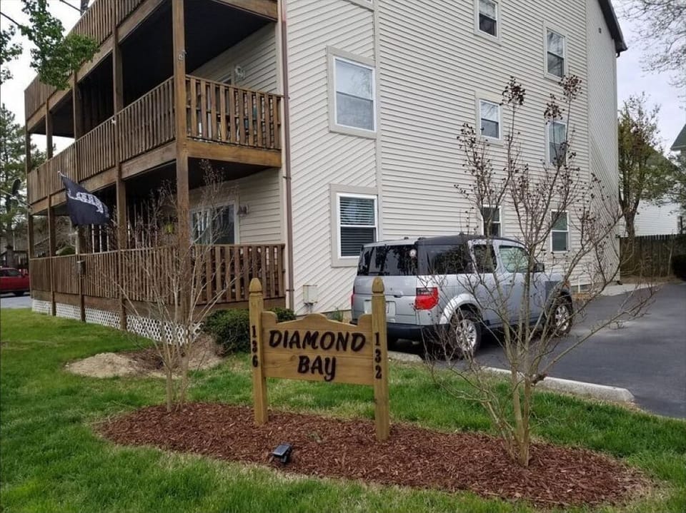 Entrance to Diamond Bay parking lot is  to the right of sign.