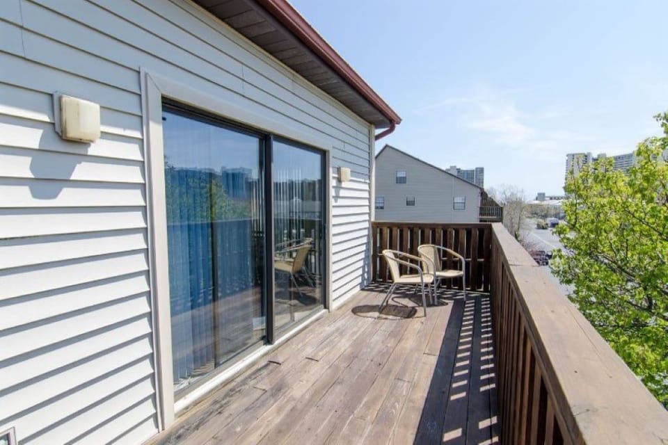 view of deck showing sliding door to living area and dining area.