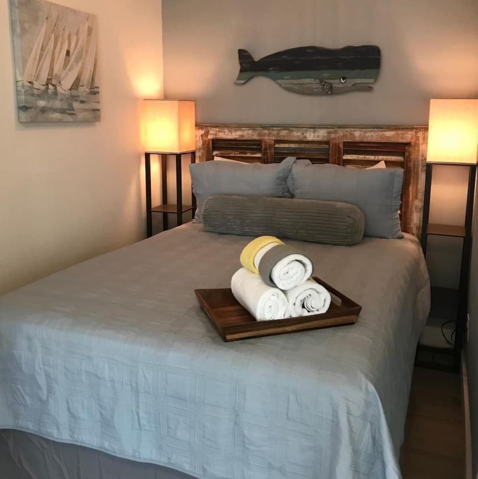 Queen bed in private room for two guests.