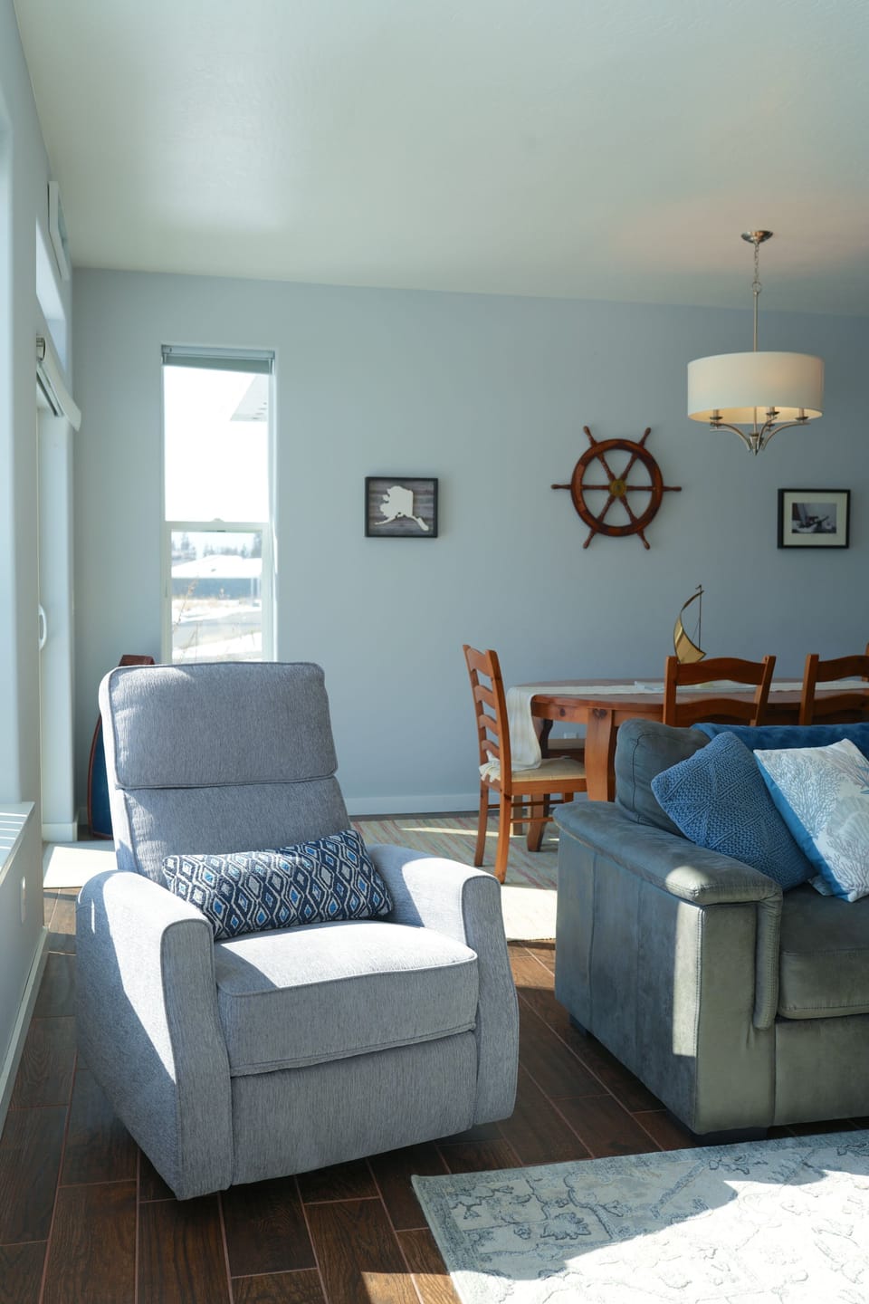 Cozy reading nook with natural light and peaceful Homer views.