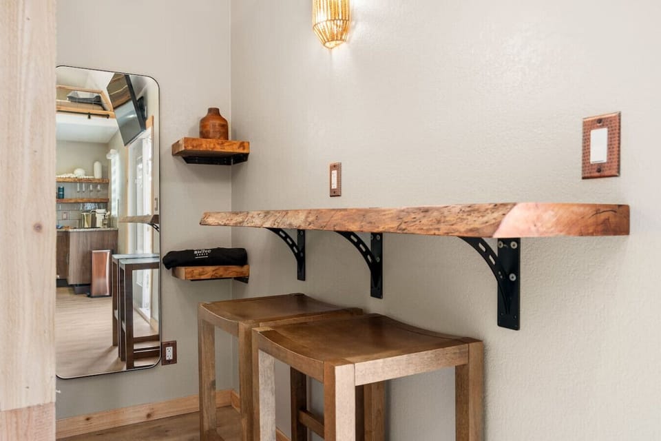 Entryway Nook: Stylish wood accents where you can enjoy a meal or use a desk