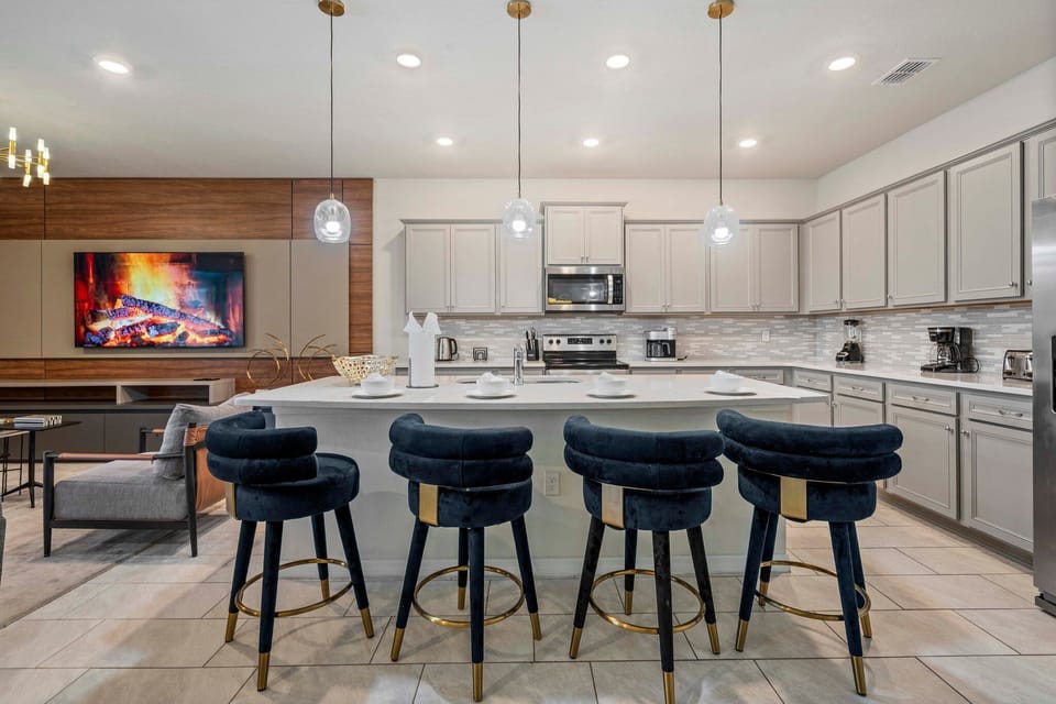 Enjoy 4 chairs at the breakfast bar + 10 seats at dining table & 8 on patio.