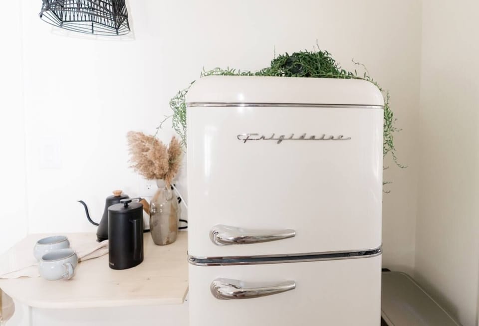 a retro refrigerator completes our full kitchen (not a full sized fridge but fits everything you need during your stay)
