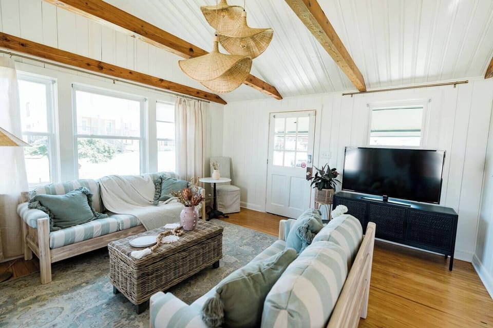 professionally designed home with restored handmade couches, games are located in the coffee table 