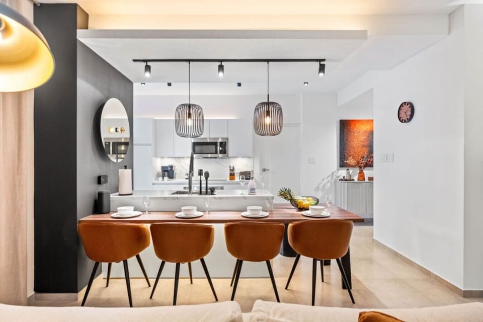 Gather around this chic kitchen island, where modern design meets inviting vibes—perfect for sharing meals and memories!