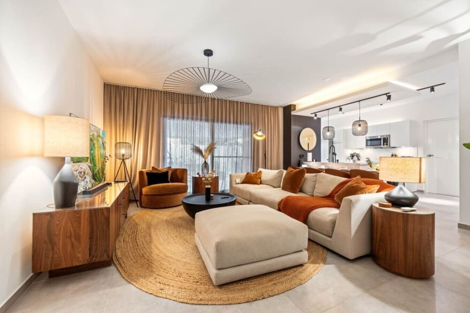 Cozy up in this stylish living room, where comfort meets warmth—perfect for relaxing or entertaining!