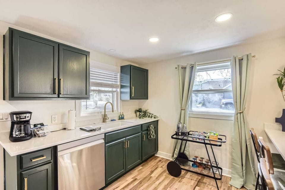 Gather in the open concept, fully stocked kitchen with spacious bar seating for 6