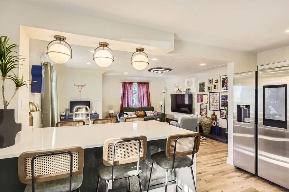 Gather in the open concept, fully stocked kitchen with spacious bar seating for 6