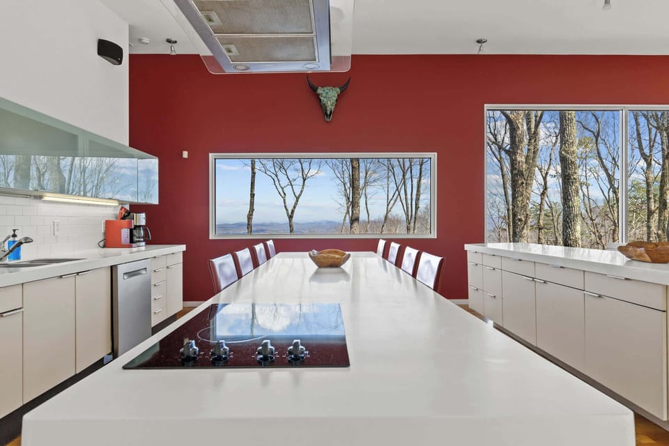 Expansive windows invite natural light and stunning mountain views, creating a warm and welcoming atmosphere.