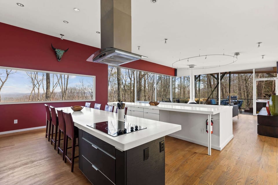 The spacious kitchen and living area blend seamlessly, offering a perfect space to cook, dine, and relax. 