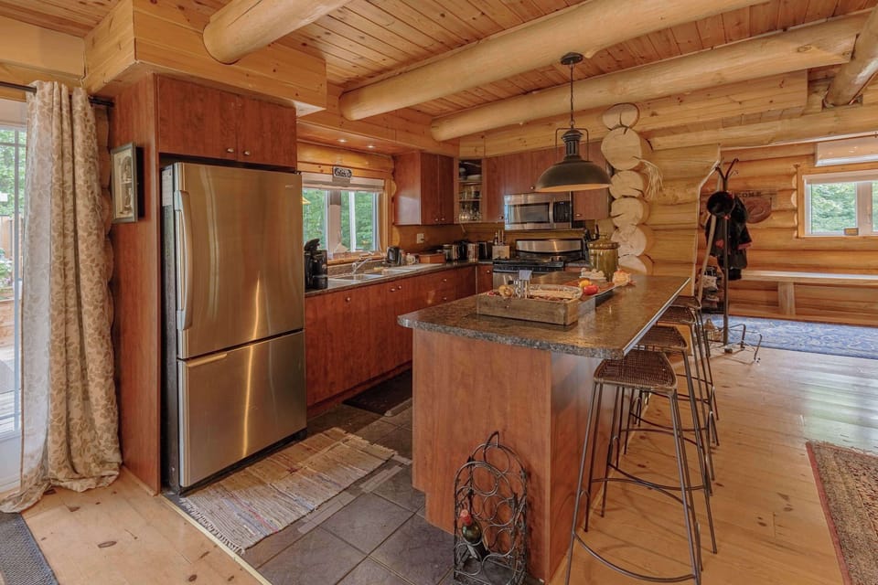 Fully equipped kitchen with granite countertops and high-end appliances