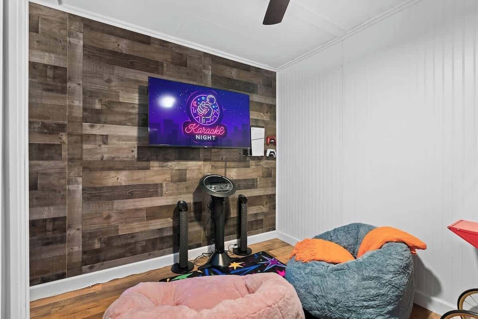 Karaoke Room: Unleash your inner star with our fun-filled karaoke setup and vibrant seating!
