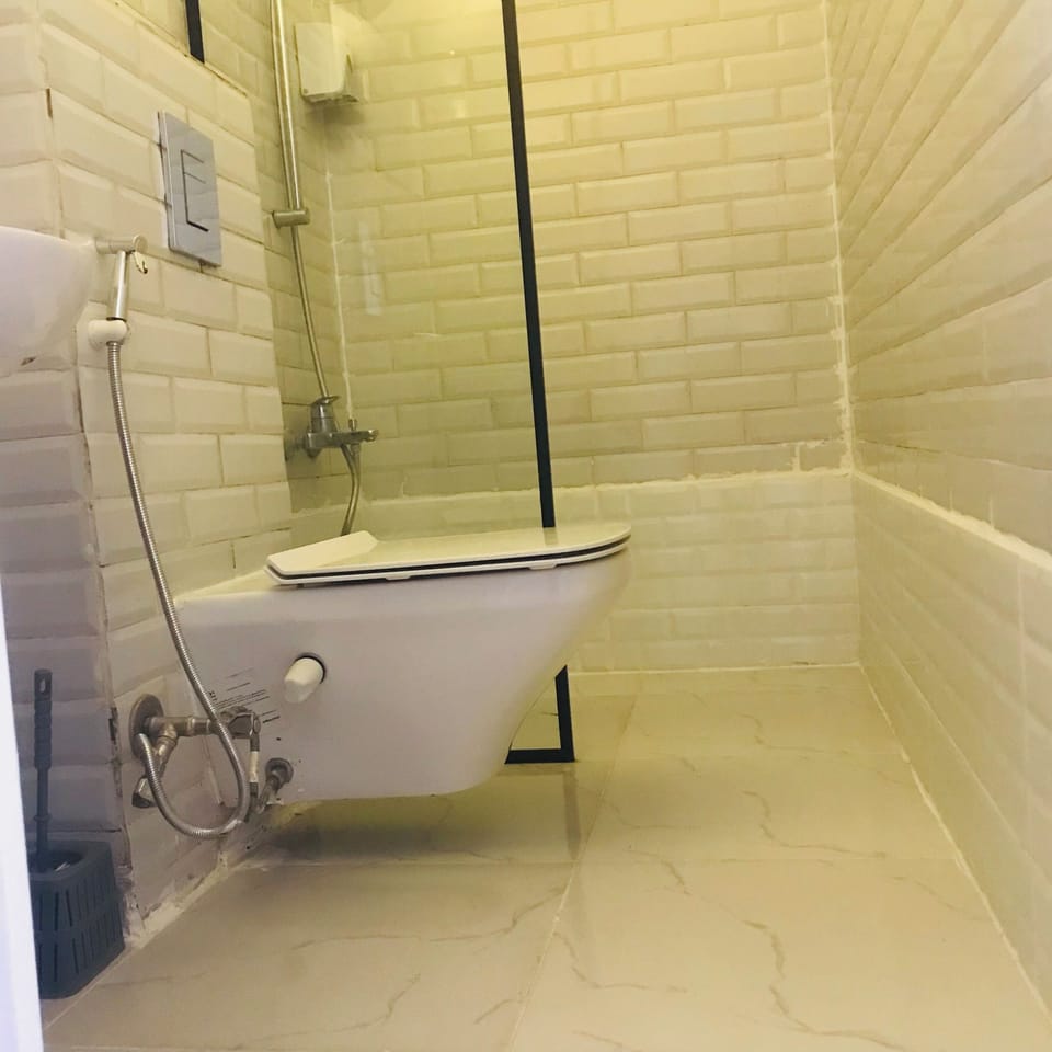 Basic Double Room, Balcony, City View | Bathroom | Bathrobes, slippers, bidet