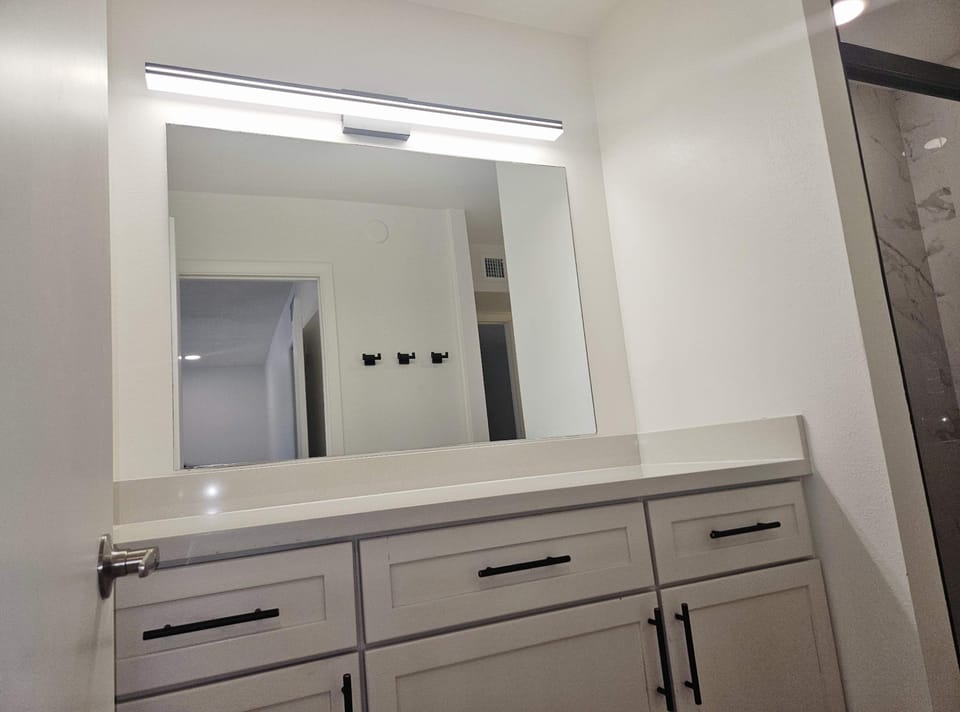 Dual vanities & a glass shower await in the second ensuite