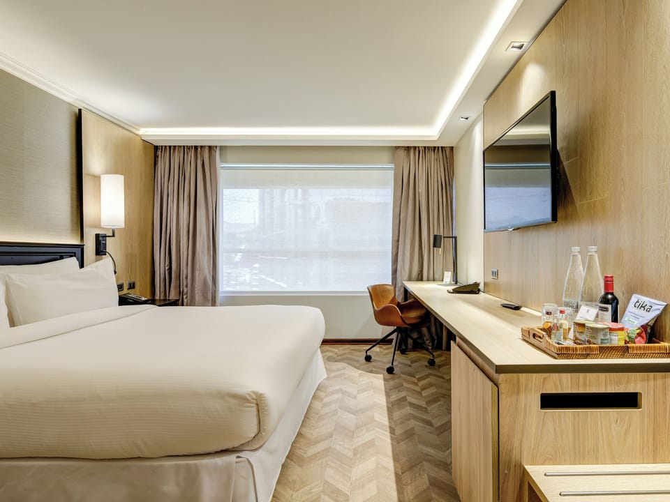 Premium bedding, down comforters, pillowtop beds, minibar