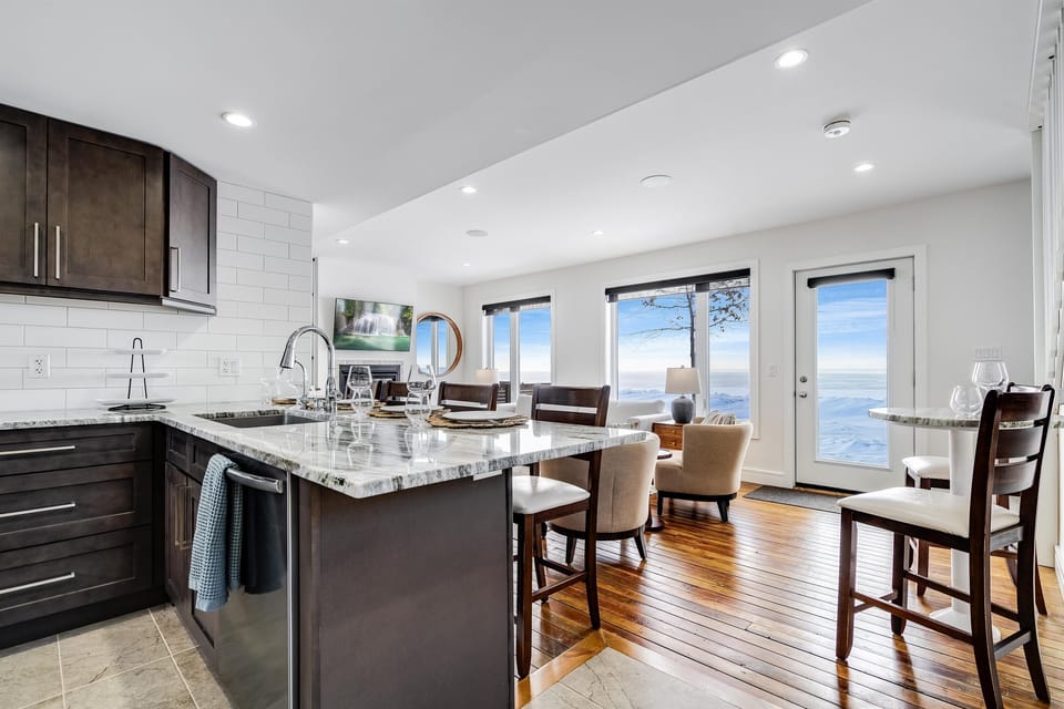 Wood accents ground the airy palette.