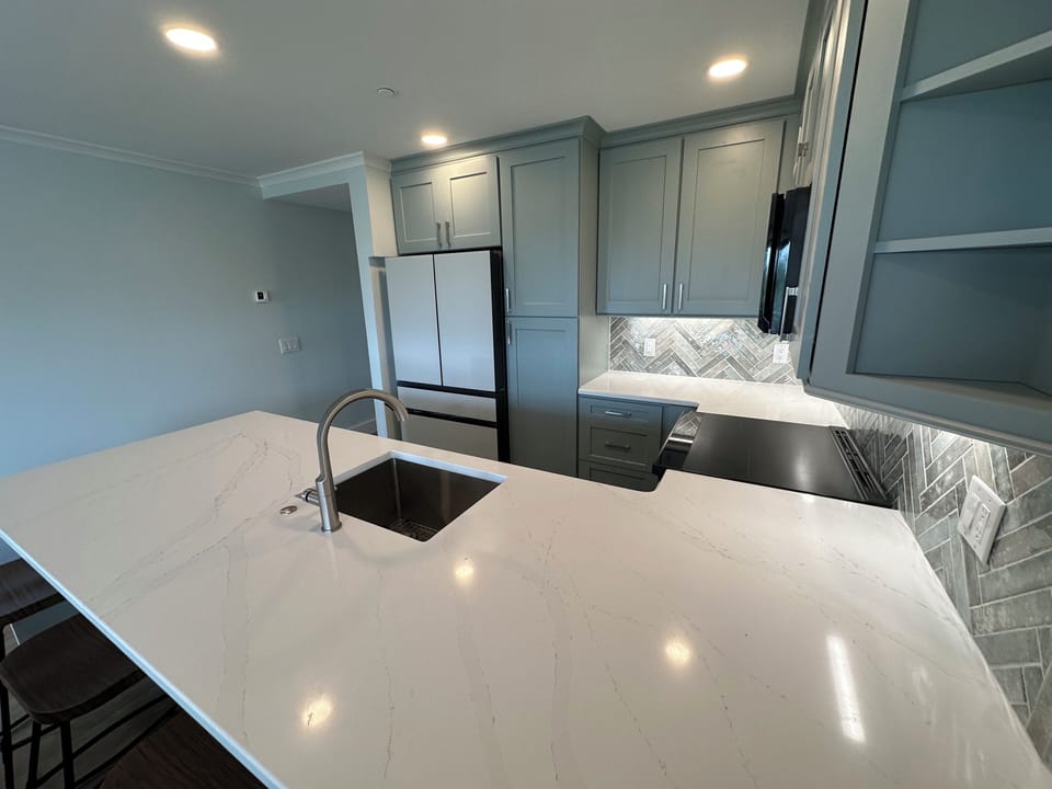 Quartz Countertops, Glass Appliances, Under Cabinet Lighting