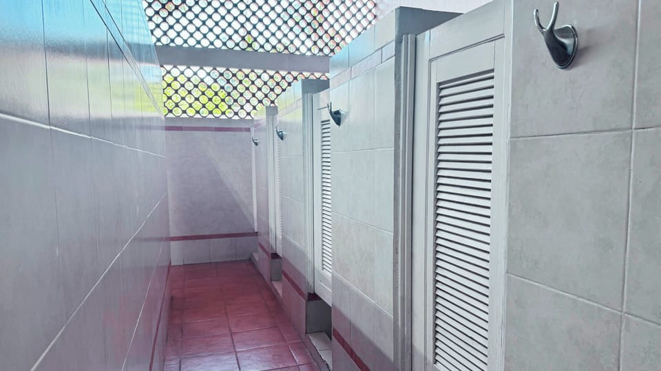 Shower stalls are available providing a clean and refreshing space.