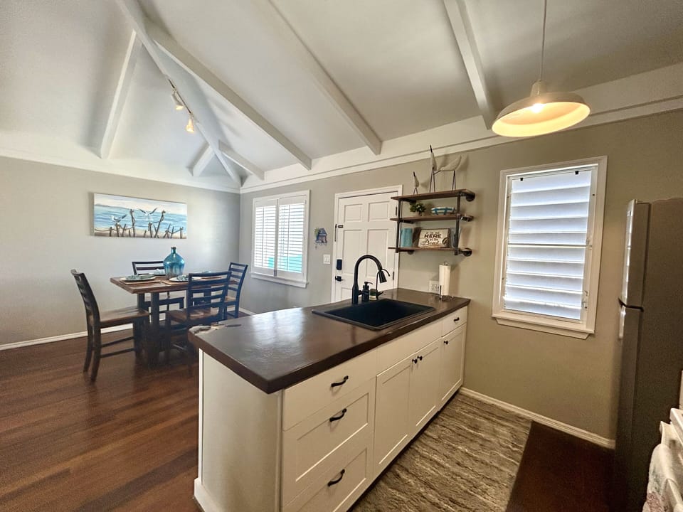 Mahogany countertops, separate faucet with filtered water, coffee pot, toaster
