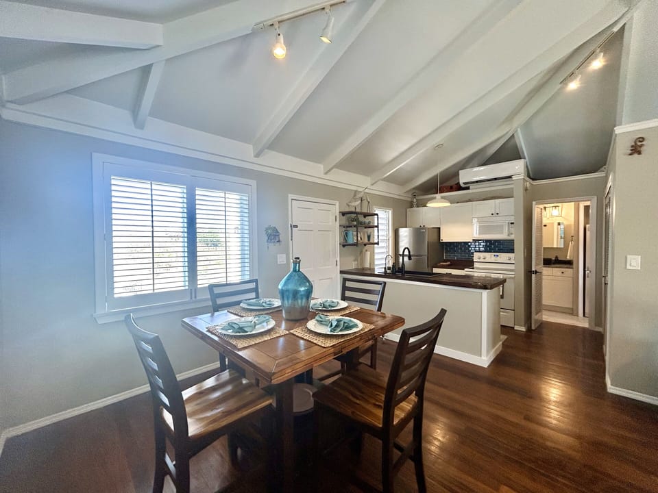 Dining area with kitchen and A/C unit