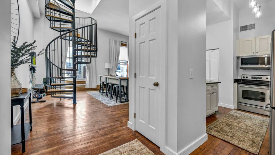 Step into style from the very first glance. This entrance hallway sets the tone with clean lines, curated décor, and a warm welcome to city living.