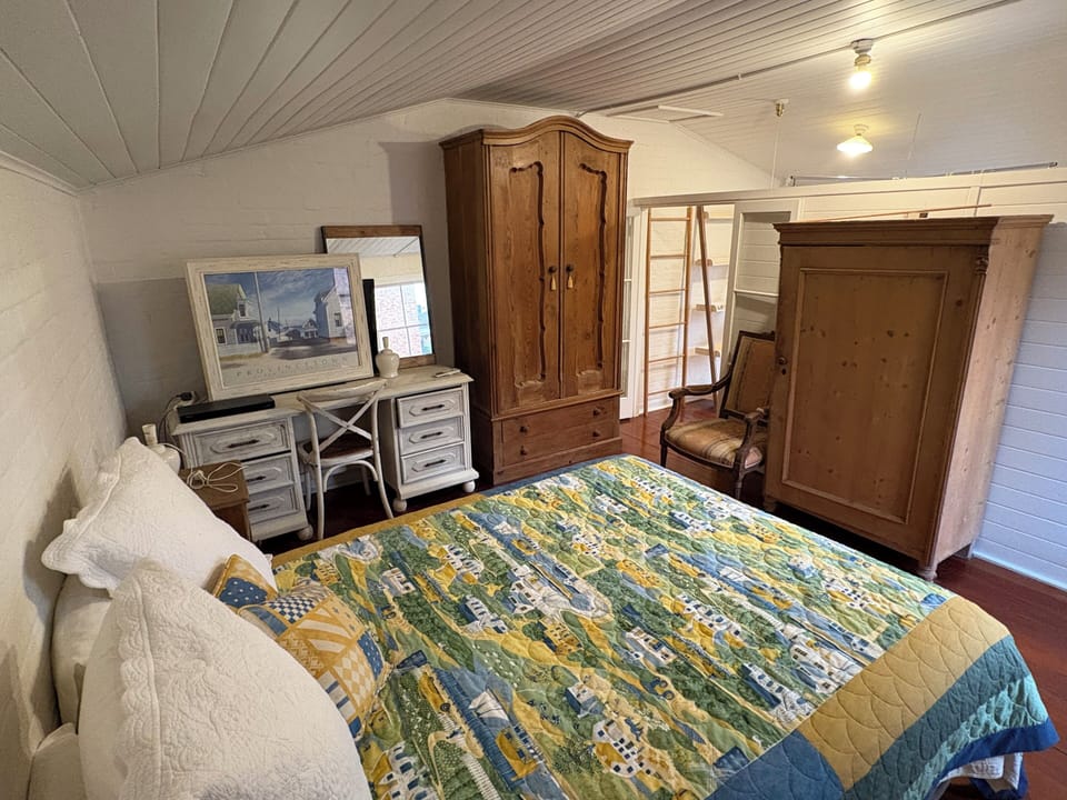 Queen Bed, Desk, Wardrobe and occasional chairs