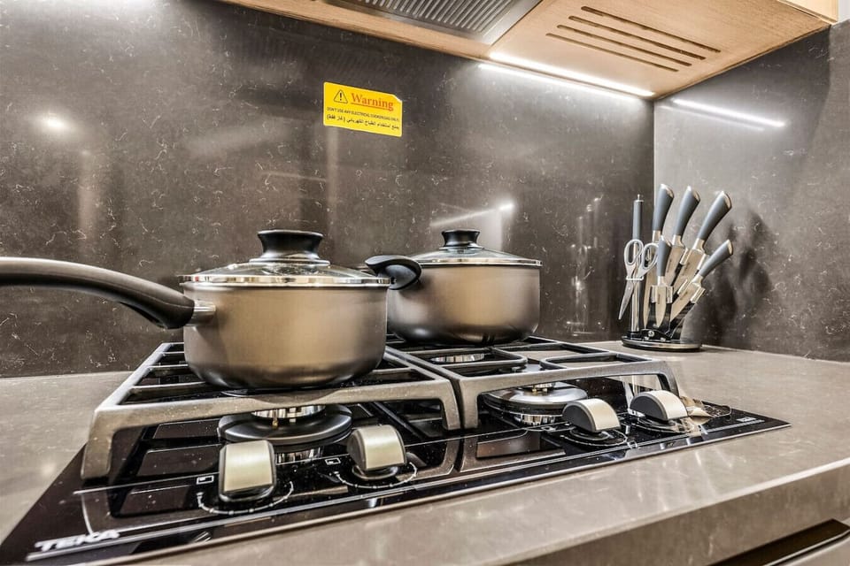 Gourmet Kitchen: Cook up a storm in a sleek, modern kitchen with high-end appliances!