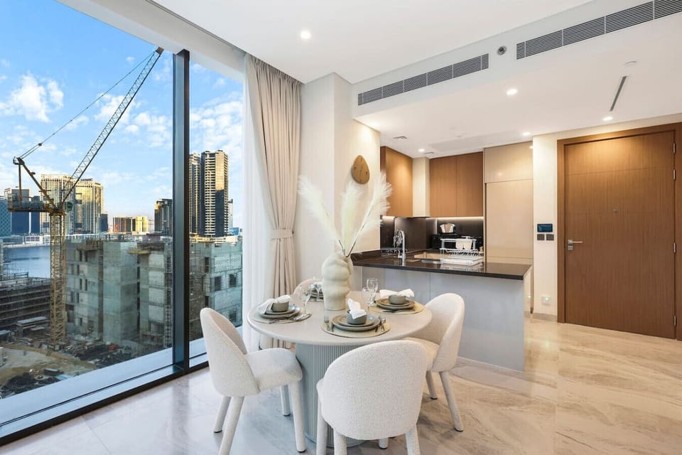 Dining Area: Modern elegance with stunning city views—perfect for memorable meals together!