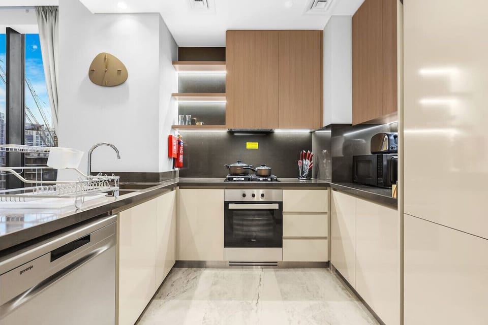 Sleek Kitchen: Cook up a storm in this modern space with sleek finishes and smart appliances!