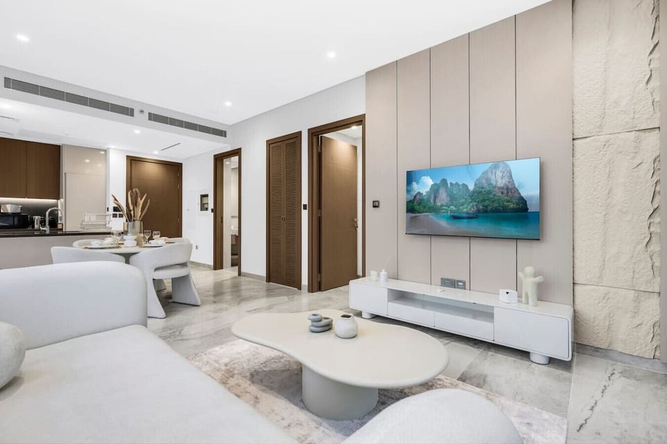 Living Room: Experience modern elegance with chic decor and stunning kitchen views!