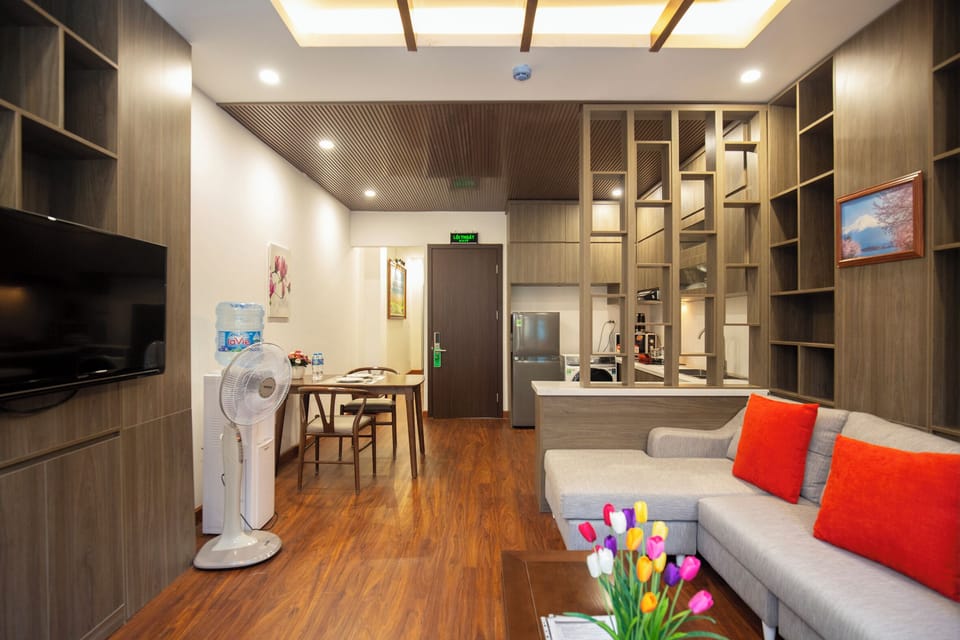 Deluxe Apartment, City View | Living area | 50-inch flat-screen TV with cable channels