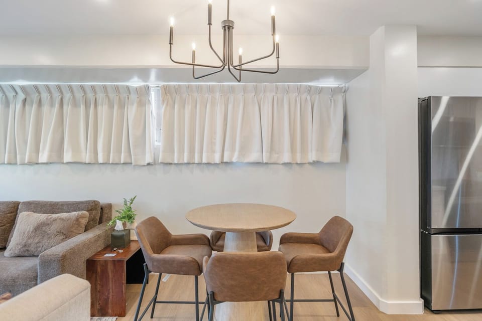 Dining Area - Share family meals or morning coffee in this cozy dining nook—bright, comfortable, and steps from the kitchen.