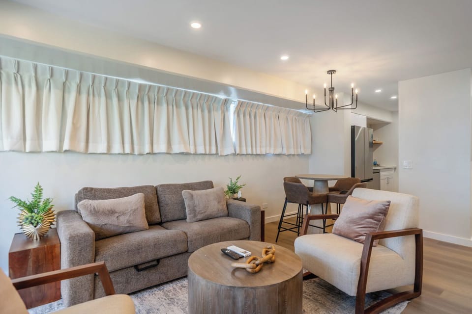 Living Room - This open layout makes it easy to connect, whether you’re watching a movie or planning your next island adventure.