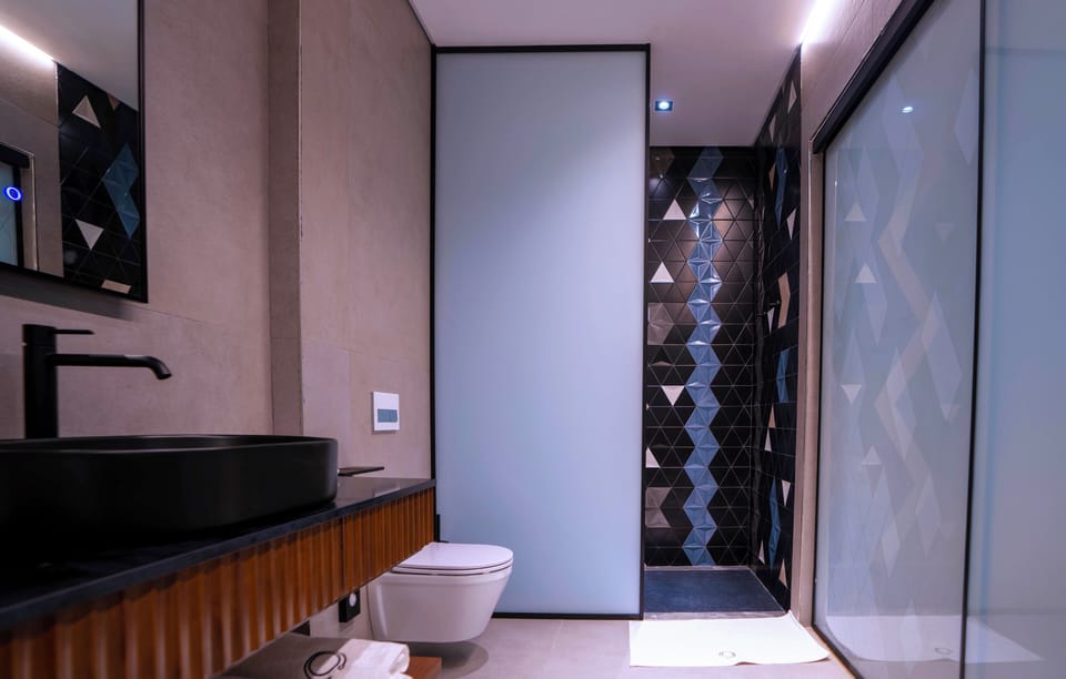 Shower, hair dryer, slippers, towels