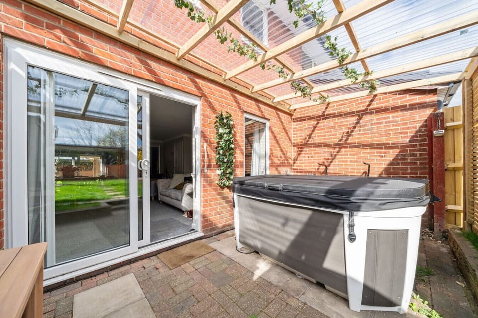 Patio area with covered hot tub