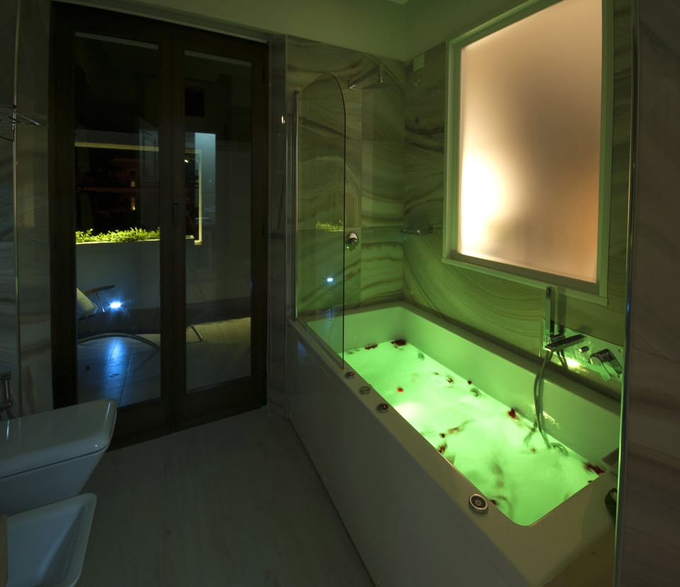 Executive Suite, 1 King Bed, Terrace, City View | Bathroom | Eco-friendly toiletries, hair dryer, bathrobes, slippers
