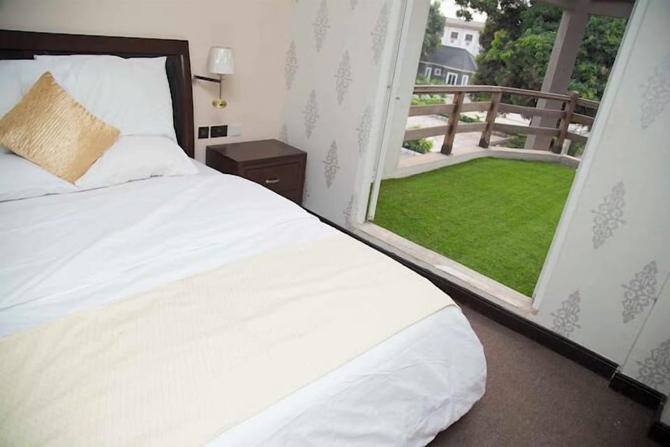 Deluxe Room, Balcony, City View | Desk, laptop workspace, blackout drapes, soundproofing
