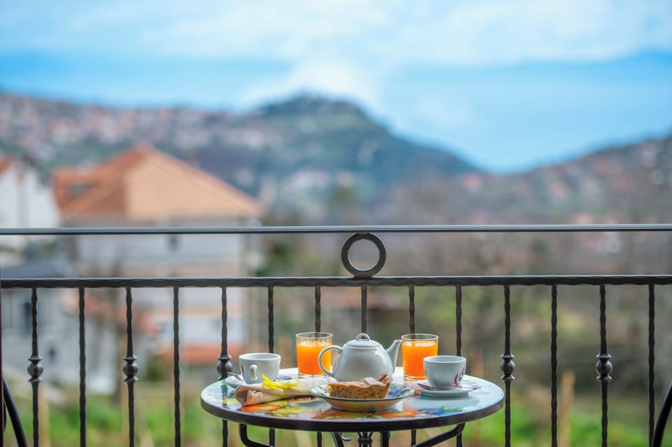 Deluxe Quadruple Room, Sea View | In-room safe, desk, laptop workspace, blackout drapes