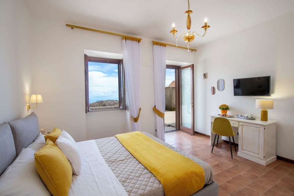 Comfort Triple Room, Sea View | In-room safe, desk, laptop workspace, blackout drapes