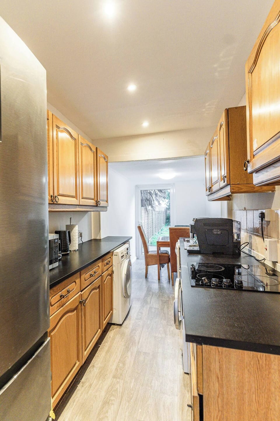 Microwave, washing machine, and heat pump dryer for added convenience.