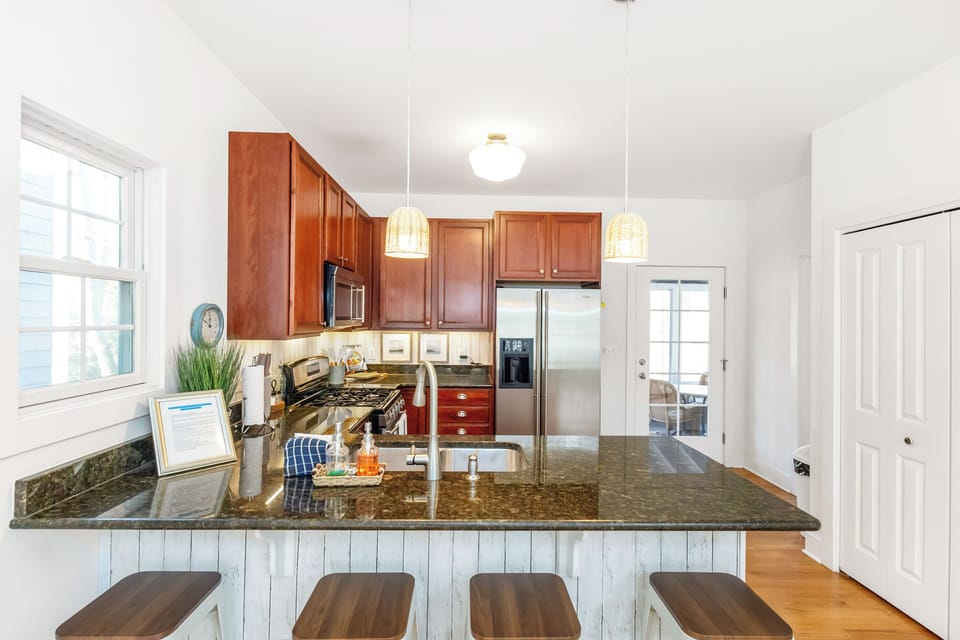 Pull up a chair to the kitchen peninsula and savor your favorite beverage in style