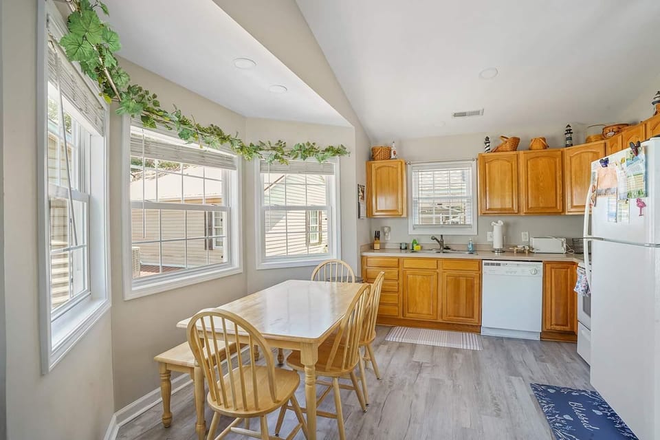 Sunny kitchen nook with cozy dining and garden views