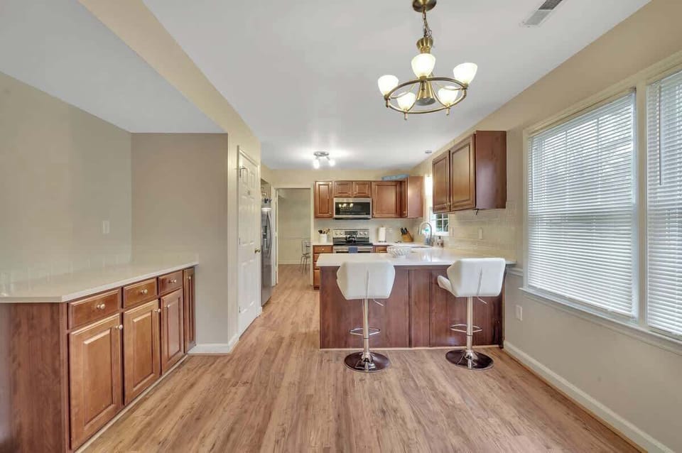 Extra counter space and storage in the breakfast area 