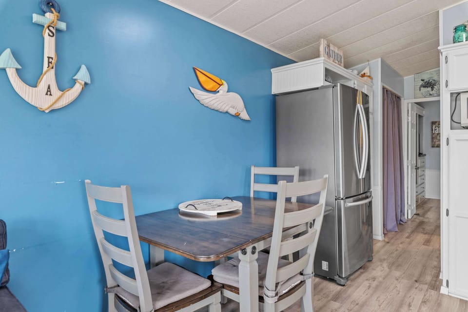 Share meals at the dining table steps from the kitchen