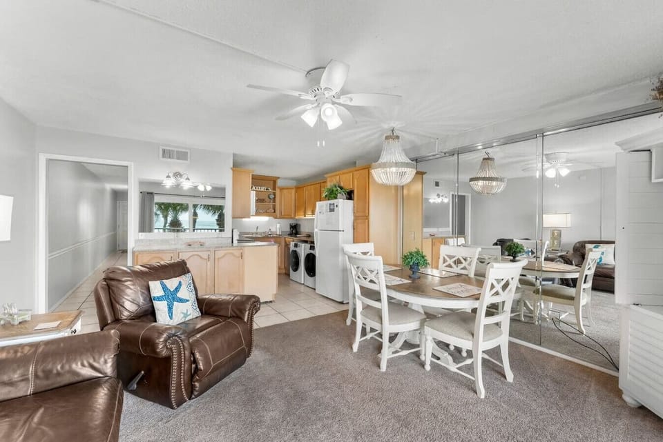 Spacious living room with Queen size fold out sofa, dining area and fully stocked kitchen