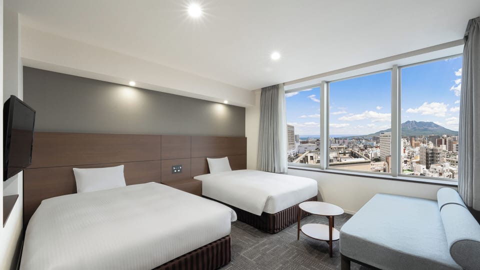 Deluxe Twin Room, Non Smoking | In-room safe, laptop workspace, blackout drapes