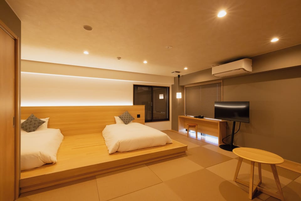 Superior Quadruple Room, City View | In-room safe, WiFi (free), bed sheets